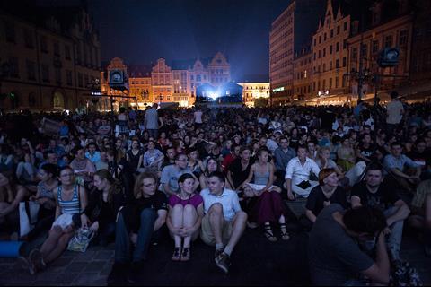 Audiences packed onto the market square for the evening open-air screenings, including Mania - The Cigarette Factory Worker